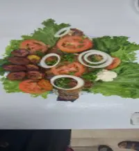 A plate of food on top of lettuce.