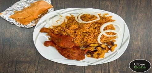 A plate of food with rice, meat and onions.