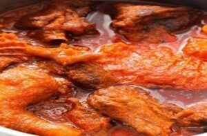 A close up of some meat in sauce