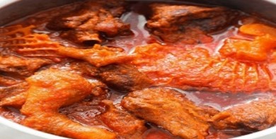 A close up of some meat in sauce